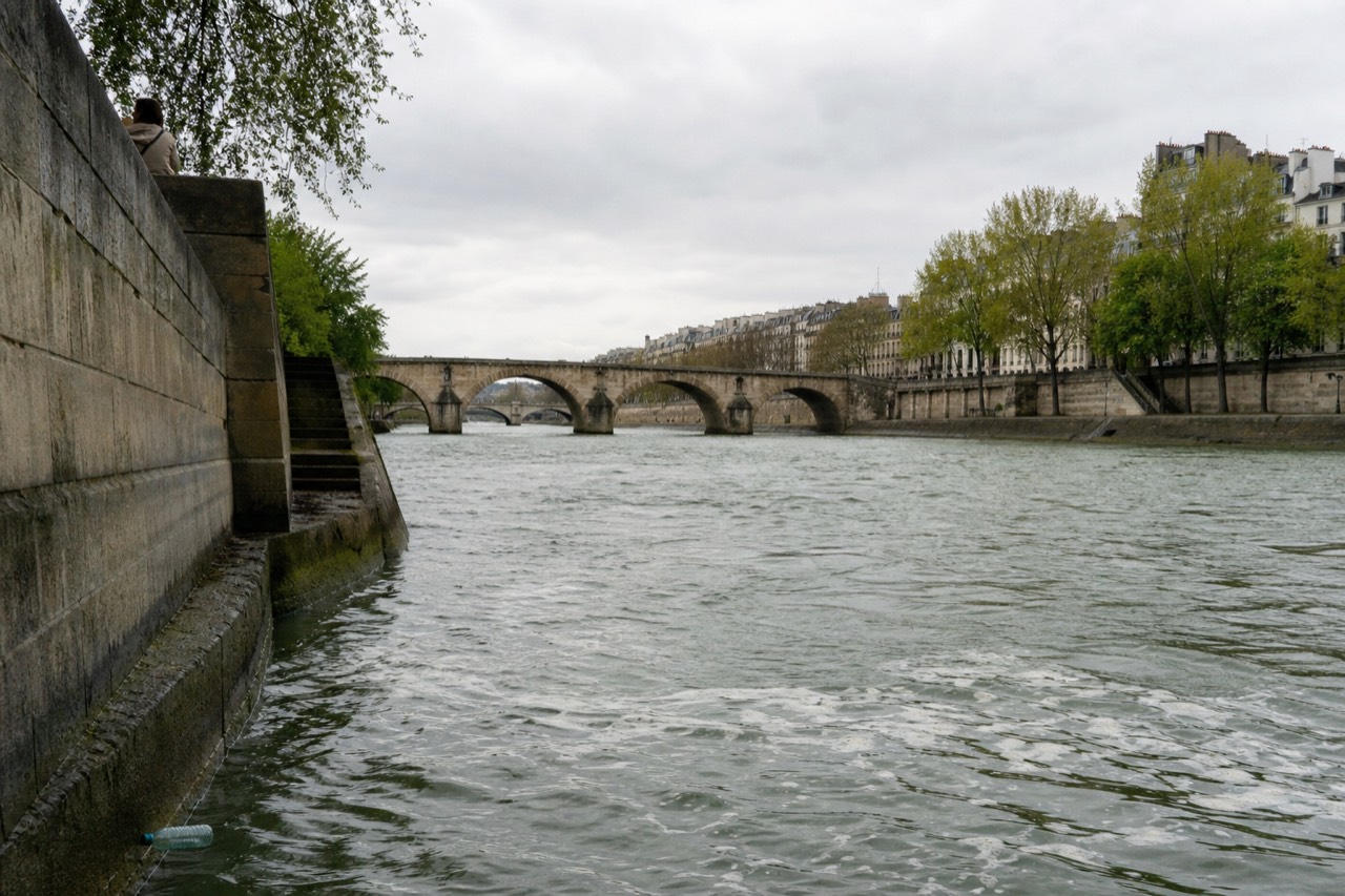 View along the Seine in Paris with bridges and river water, no text, no logos, no people