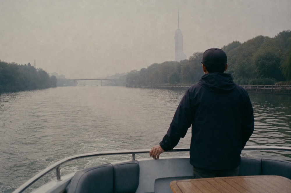 A quiet electric boat on the Seine with the Eiffel Tower in the background, no text, no logos, no people