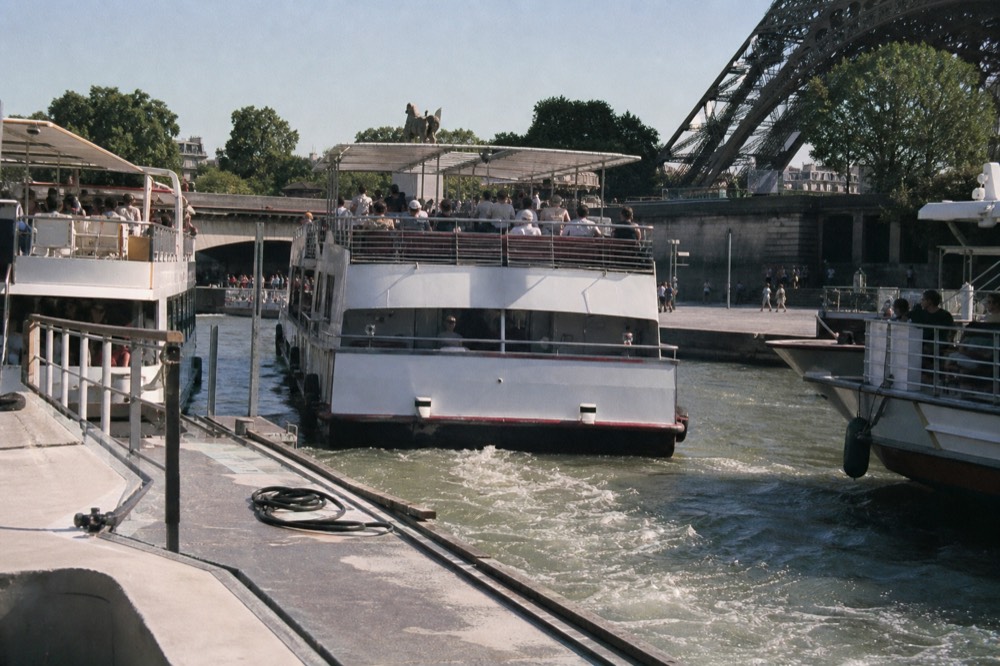 Seine river cruise boats near the Eiffel Tower, no text, no logos, no people