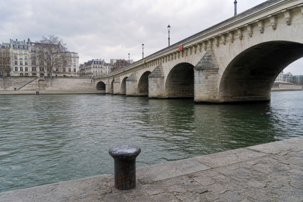 Pont Neuf bridge over the Seine seen from the riverbank, no text, no logos, no people