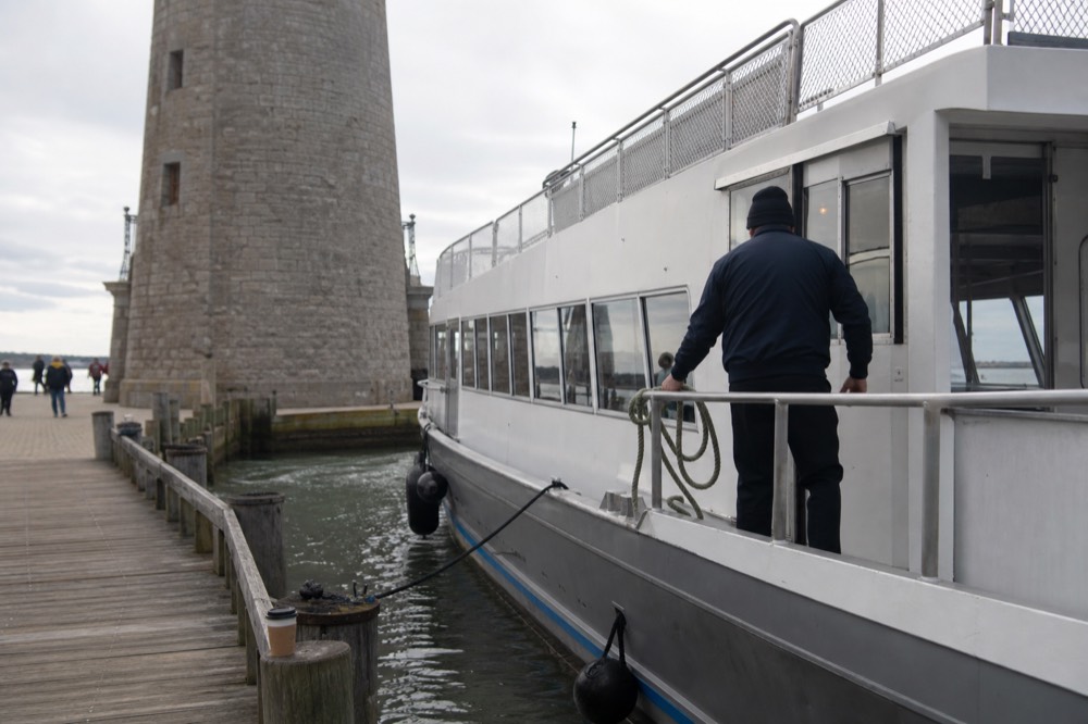 A boarding pier on the Seine with a moored passenger boat near the Eiffel Tower, no text, no logos, no people
