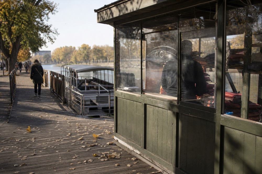 A ticket booth and boarding pontoon on the Seine quay in Paris, no text, no logos, no people